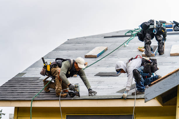 Professional Gutter Installation technician working in Bedford, NY